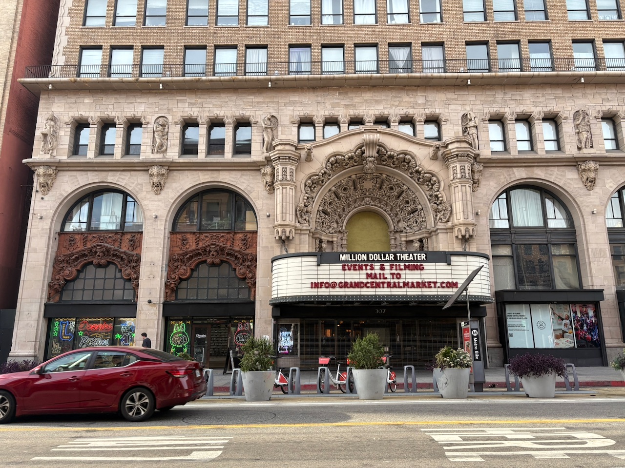 The ornate facade of the Million Dollar Theatre with its elaborate terra cotta detailing and marquee